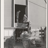 Checking in equipment from FSA (Farm Security Administration) mobile camps as it arrives at the FSA permanent camp at Caldwell, Idaho