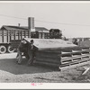 Checking in equipment from FSA (Farm Security Administration) mobile camps as it arrives at the FSA permanent camp at Caldwell, Idaho