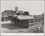 Checking in equipment from FSA (Farm Security Administration) mobile camps as it arrives at the FSA permanent camp at Caldwell, Idaho