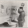 Lee Wagoner, farmer on Black Canyon Project, washes up for dinner. Canyon County, Idaho