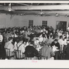Workmen at Shasta Dam eating dinner at the commissary. Shasta County, California