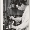 Salinas, California. Intercontinental Rubber Producers. Harry Baucher, head chemist, works on deresinating tests