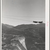 Shasta Dam under construction. The many cables are for transporting materials. Shasta County, California