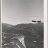 Shasta Dam under construction. The many cables are for transporting materials. Shasta County, California