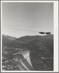 Shasta Dam under construction. The many cables are for transporting materials. Shasta County, California