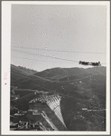 Shasta Dam under construction. The many cables are for transporting materials. Shasta County, California
