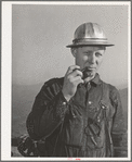 Workman at Shasta Dam. Shasta County, California