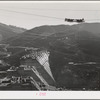 Shasta Dam under construction. The many cables are for transporting materials. Shasta County, California