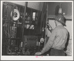 This workman controls amounts of materials going into concrete used in construction of Shasta Dam. Shasta County, California