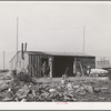 Mr. Palmer is living here while he builds his new house, made possible through a FSA (Farm Security Administration) real estate loan. Black Canyon Project, Canyon County, Idaho