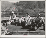 Workers on Pit River bridge eat lunch. Shasta County, California