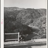 Workman putting up the railing on Pit River bridge. Shasta County, California