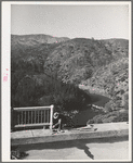 Workman putting up the railing on Pit River bridge. Shasta County, California