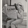 Workman at Shasta Dam reads war extra. Shasta County, California