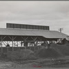 A byproducts plant in olive oil industry. The mounds are the pomace left after "soap" oil is extracted. This pomace has some value as a fertilizer. Strathmore, California