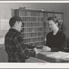 Workman registering at office of the FSA (Farm Security Administration) defense dormitories at Vallejo, California. These dormitories are for the workmen at the Mare Island navy yards