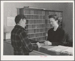 Workman registering at office of the FSA (Farm Security Administration) defense dormitories at Vallejo, California. These dormitories are for the workmen at the Mare Island navy yards