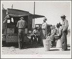 Pea pickers stop for a soft drink. Imperial County, California