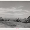 Farmyard, Imperial County, California. In Imperial County, comparatively few farm owners live on the farms, usually the houses seen on the farms are those of the foremen