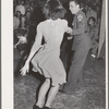 Jitterbug contest at the dance which closed the second annual field day at the FSA (Farm Security Administration) farm workers' community. Yuma, Arizona. Some of the boys from a nearby Army camp were visitors for the day