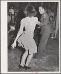 Jitterbug contest at the dance which closed the second annual field day at the FSA (Farm Security Administration) farm workers' community. Yuma, Arizona. Some of the boys from a nearby Army camp were visitors for the day