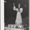 Exhibit at the Imperial County Fair, California. The words at the base of statue are "Vitamins for Victory." Notice the plowshares on corners of exhibit