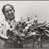 Marileeann Simpson holds a pan of vegetables freshly gathered from her family's garden at the FSA (Farm Security Administration) farm workers community. Yuba City, California