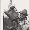 Grant County, Oregon. Malheur National Forest. Lumberjack drinking from desert water bag