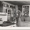 Ola, Idaho. FSA (Farm Security Administration) Ola self-help cooperative. Wife and child of a member in the kitchen of their home