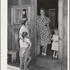 Ola, Idaho. FSA (Farm Security Administration) Ola self-help cooperative. Wife of a member talks with her visiting neighbor who is also a member of the cooperative. The mother and child standing in the doorway are the same as in photograph 21657-C taken
