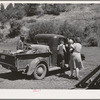 Ola, Idaho. FSA (Farm Security Administration) Ola self-help cooperative. A member and his family starts to town