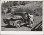Ola, Idaho. FSA (Farm Security Administration) Ola self-help cooperative. A member and his family starts to town