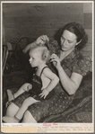 Ola, Idaho. FSA (Farm Security Administration) Ola self-help cooperative. Wife of a member and his son