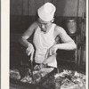 Rupert, Idaho. Former CCC (Civilian Conservation Corps) camp now under FSA (Farm Security Administration) management. Chef carving meat for supper at the community mess hall of the Japanese-Americans