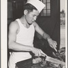 Rupert, Idaho. Former CCC (Civilian Conservation Corps) camp now under FSA (Farm Security Administration) management. Chef carving meat for supper at the community mess hall of the Japanese-Americans