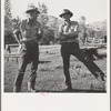 Ola, Idaho. Member of the Ola self-help cooperative talking to a customer of the cooperative sawmill