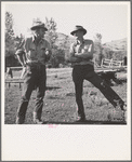 Ola, Idaho. Member of the Ola self-help cooperative talking to a customer of the cooperative sawmill