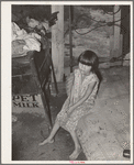 Daughter of agricultural day laborer and his tubercular wife in bedroom of shack home on Poteau Creek near Spiro, Oklahoma
