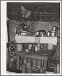 Scene in kitchen of home of Negro farm owner in Arkansas River bottoms. Near Vian, Oklahoma