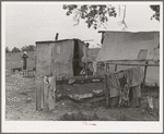 Clothes and tent of itinerant statue maker and agricultural day laborer living on Poteau Creek near Spiro, Oklahoma. Sequoyah County