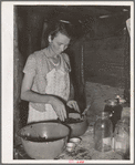 Wife of itinerant statue maker and agricultural day laborer canning blackberries. Poteau Creek near Spiro, Oklahoma, Sequoyah County