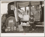 Belongings of migrant family packed in and around car near Muskogee, Oklahoma. Muskogee County