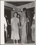 Young couple at square dance in rural section of hills near McAlester, Pittsburg County, Oklahoma. Sharecropper's home