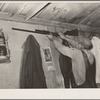 Moving the rifle which was placed on the wall before leaving for California from Muskogee, Oklahoma