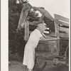 Migrant family loading truck preparatory to departure for California. Near Muskogee, Oklahoma