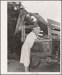 Migrant family loading truck preparatory to departure for California. Near Muskogee, Oklahoma
