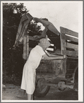 Migrant family loading truck preparatory to departure for California. Near Muskogee, Oklahoma