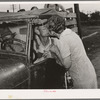 Kissing a relative goodbye. Muskogee, Oklahoma. Migrant family bound for California
