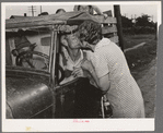 Kissing a relative goodbye. Muskogee, Oklahoma. Migrant family bound for California