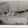 Children asleep on bed at square dance in hills near McAlester on Saturday night in home of sharecropper. Oklahoma, Pittsburg County
